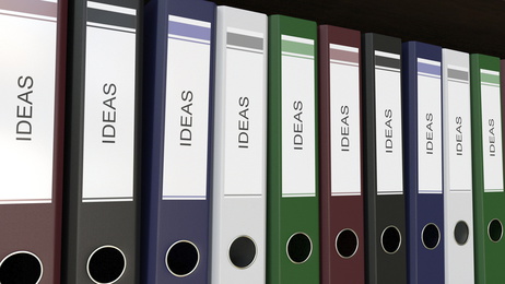 Line of multicolor office binders with Ideas tags